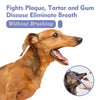 A brown dog is shown next to a small bottle of natural pet dental spray for oral care.