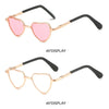 Pink heart-shaped sunglasses with gold and black frames for pets