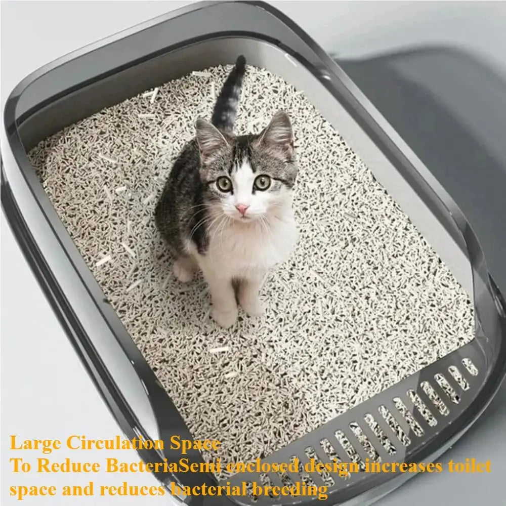 A gray semi-enclosed cat litter box with a white cat sitting inside, showing its large circulation space.