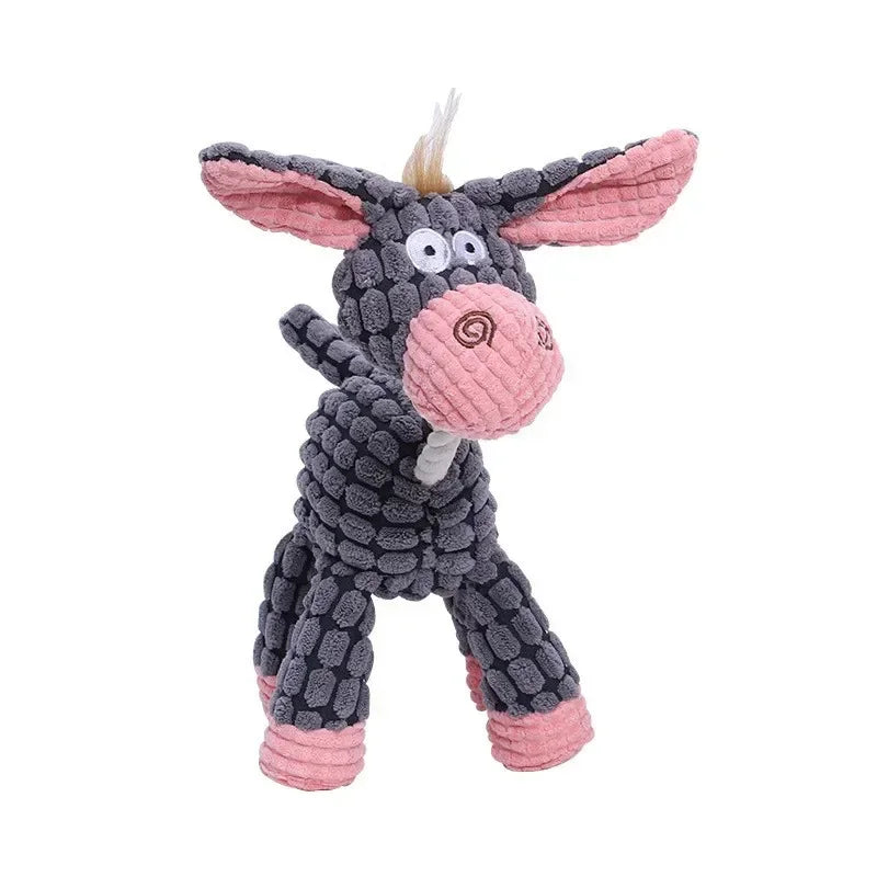 A plush squeaky dog toy shaped like a gray and pink cow with corduroy texture.