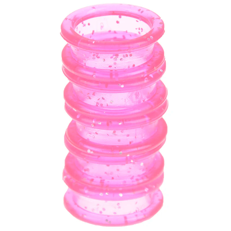 A stack of pink silica gel hair scissors, showing multiple rings with small glitter particles.