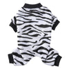 A white and black zebra print cozy winter outfit for a small dog.