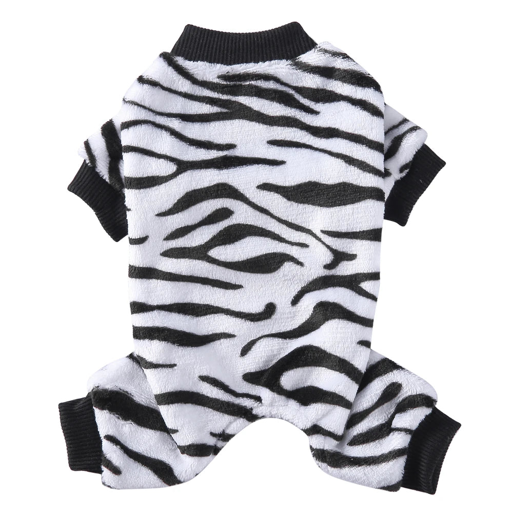 A white and black zebra print cozy winter outfit for a small dog.