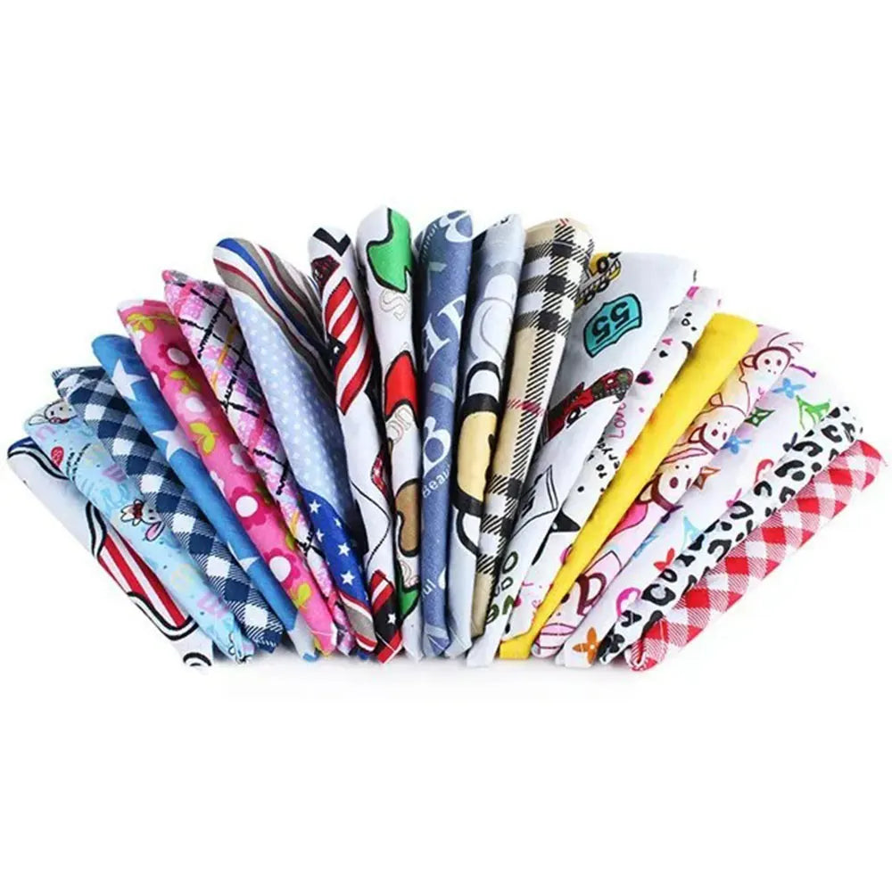 A collection of colorful cotton triangle bandanas for dogs and cats displayed in a row.