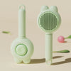 A light green pet deshedding brush for cats and dogs with a self-cleaning design shown against a beige background.