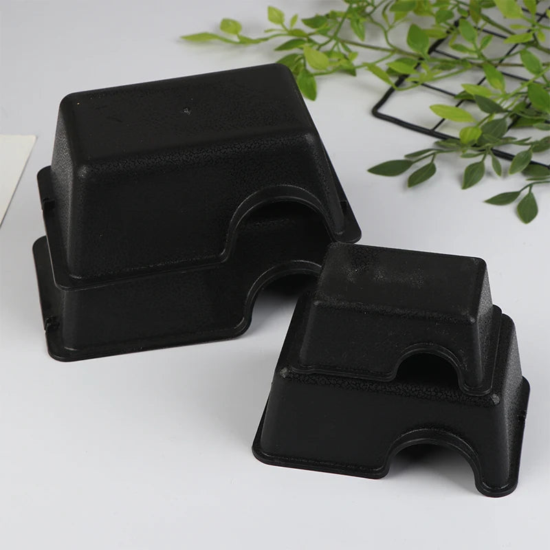 Black reptile and small animal hide box with a textured, rectangular design