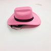 A bright pink felt cowboy hat with a black band, shown from above.