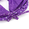 Purple fabric play tube or bow with white polka dots