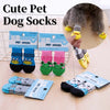 A collection of cute pet dog and cat socks in various colors and patterns displayed on a white background.