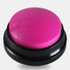 A round, bright pink talking pet training button with a black base.