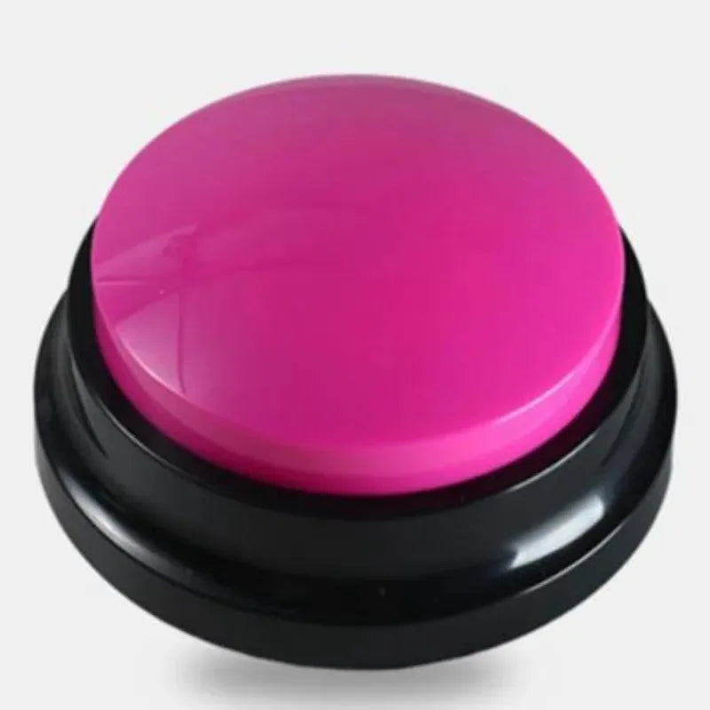 A round, bright pink talking pet training button with a black base.