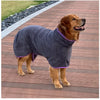 A brown dog wearing a gray quick-dry microfiber robe on a wooden deck.