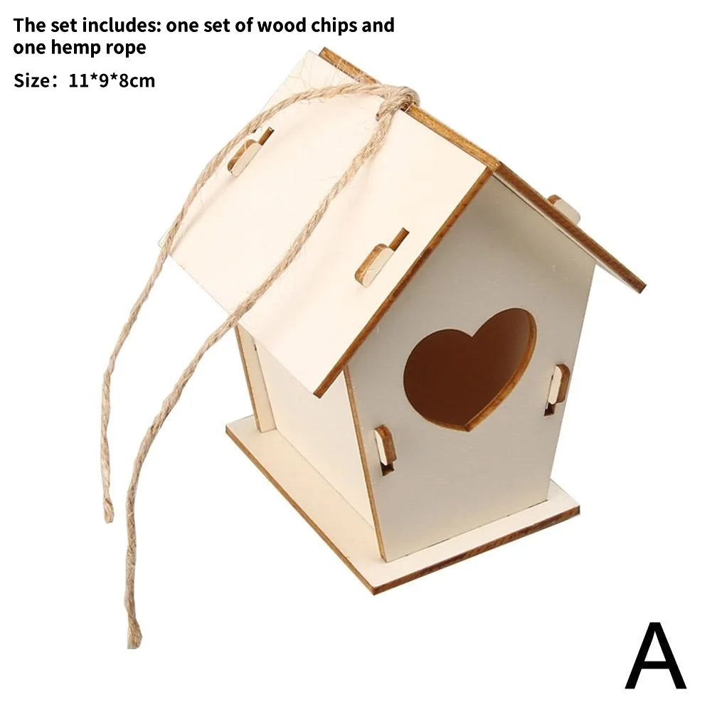 A wooden bird house kit with a slanted roof and a heart cutout, tied with hemp rope.
