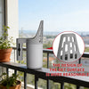 A white cat litter scoop and sifter is displayed on a balcony railing with a blurred city view in the background.
