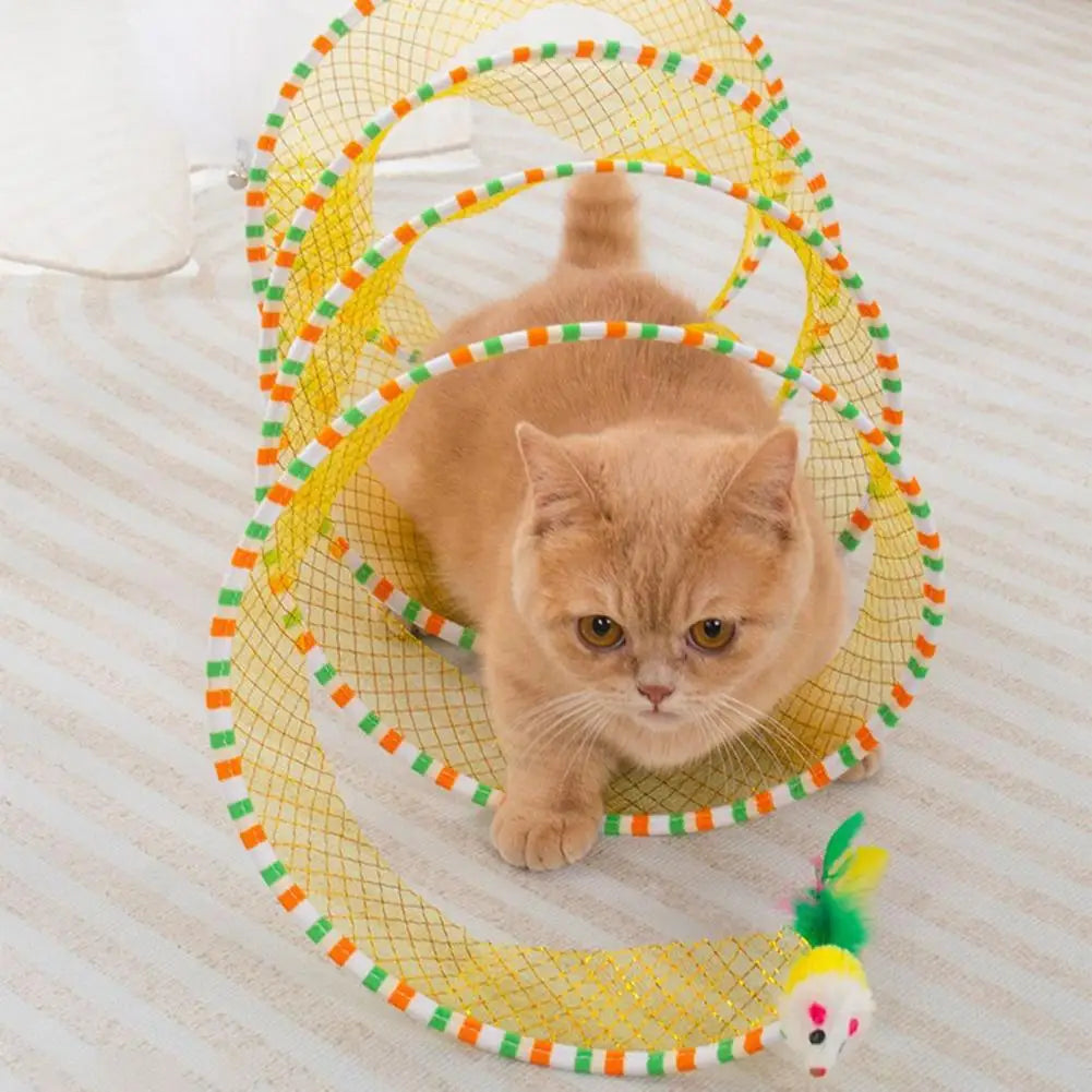 A fluffy orange cat is visible inside a yellow mesh foldable hunting tunnel for indoor play.