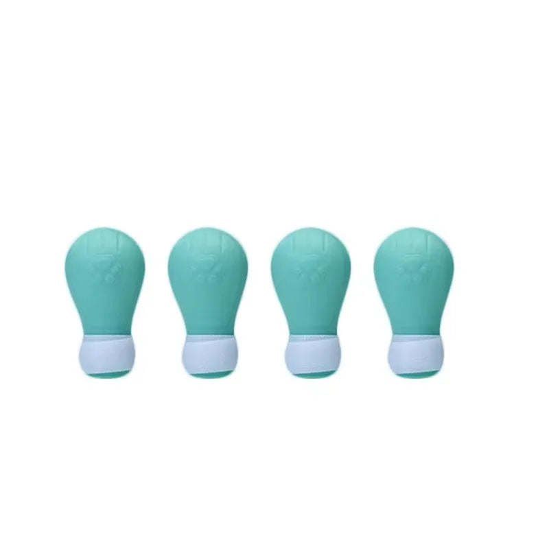 A set of four teal silicone paw shoes for cat grooming.