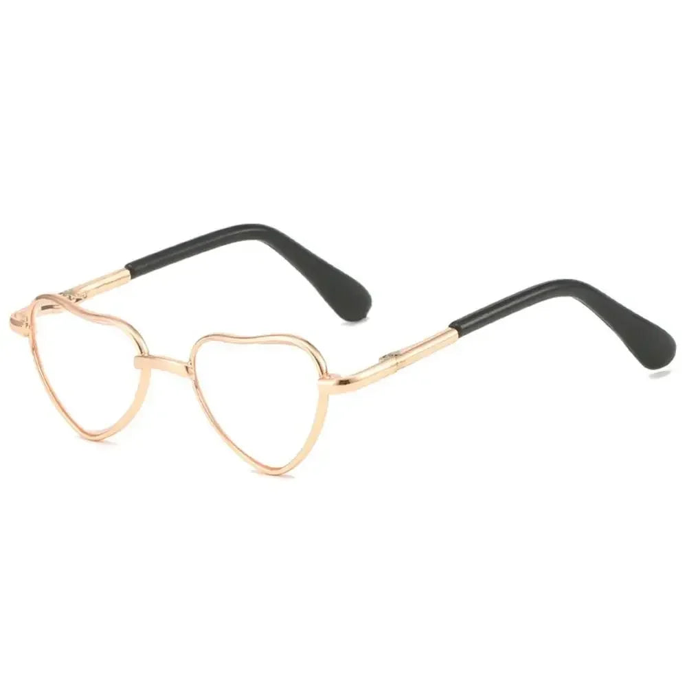 Funny heart-shaped pet sunglasses for cats and dogs with gold and black frames