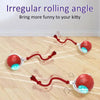 A red, irregular rolling angle cat toy is shown moving across a wooden floor.