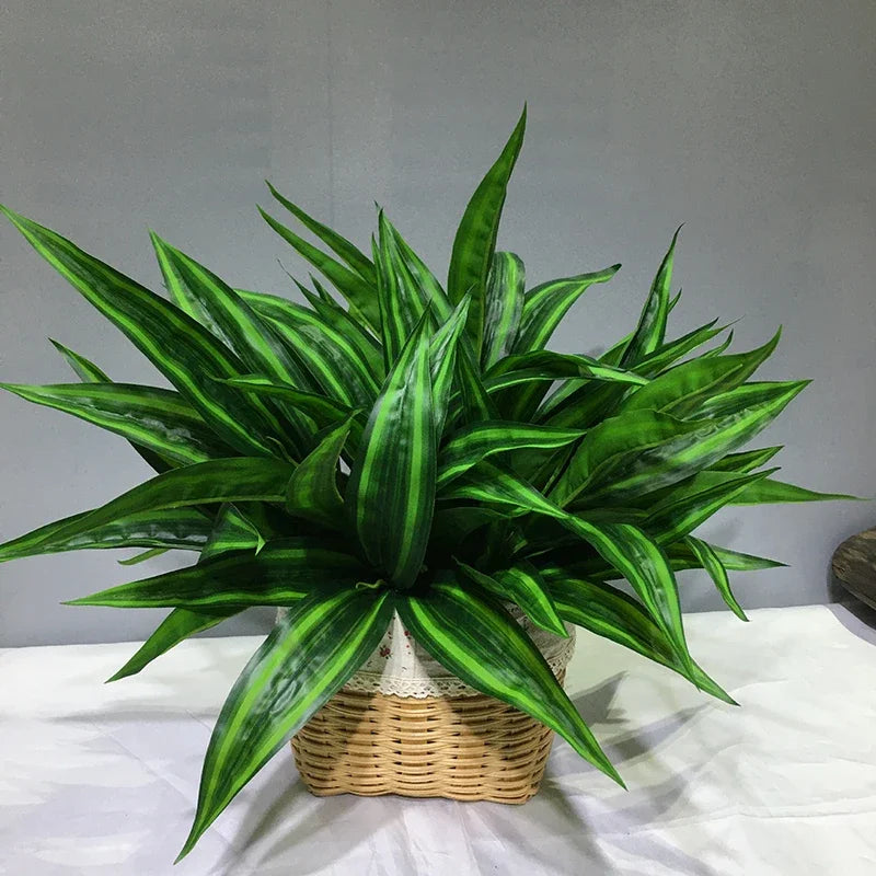 A vibrant green artificial tropical palm plant with long, sword-like leaves potted in a woven basket.