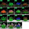 A collection of realistic artificial aquarium plants in various colors including green, red, purple, and yellow.