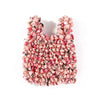 A close-up of a reusable foldable bubble shopping bag made of pink and red floral fabric.