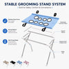 A blue stainless steel grooming stand system with a fabric hammock and folding frame for pet grooming.