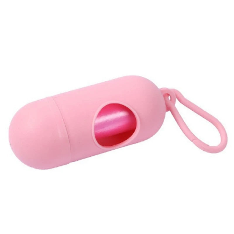 Pink capsule-shaped dog poop bag dispenser with a carabiner clip.