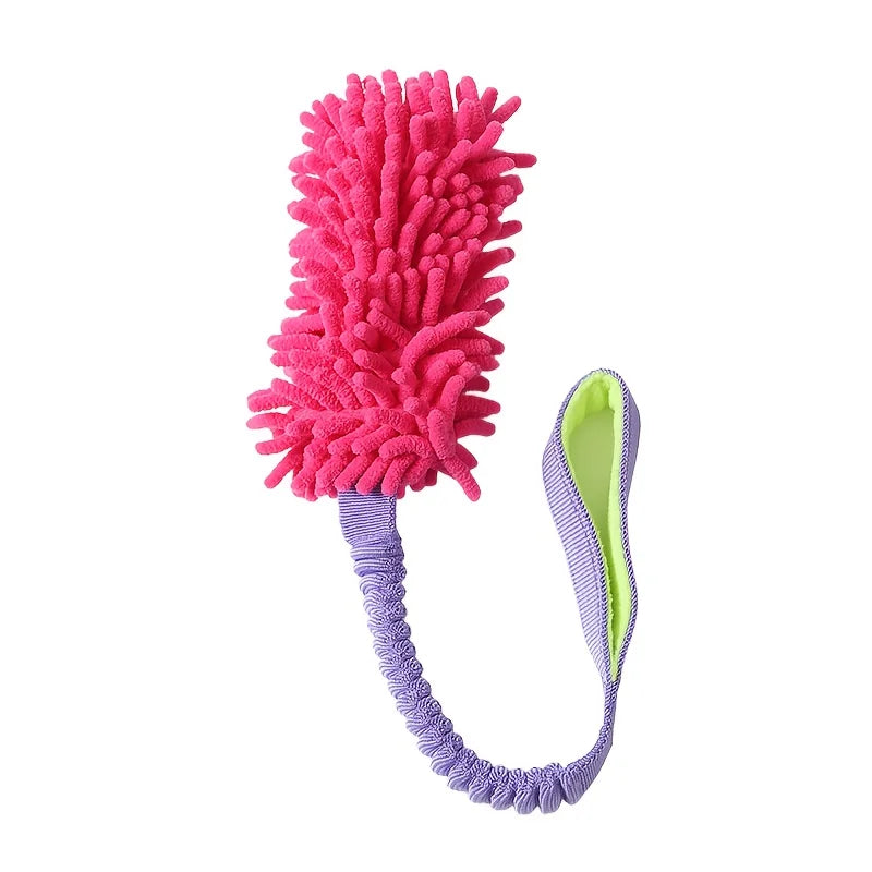 A bright pink plush pull rope toy with a purple handle and green accents.