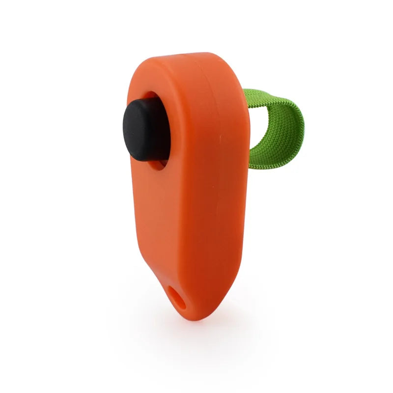 Orange pet training clicker with a black button and a green grip.