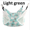Light green fleece hammock for small pets with white and gray paw print pattern