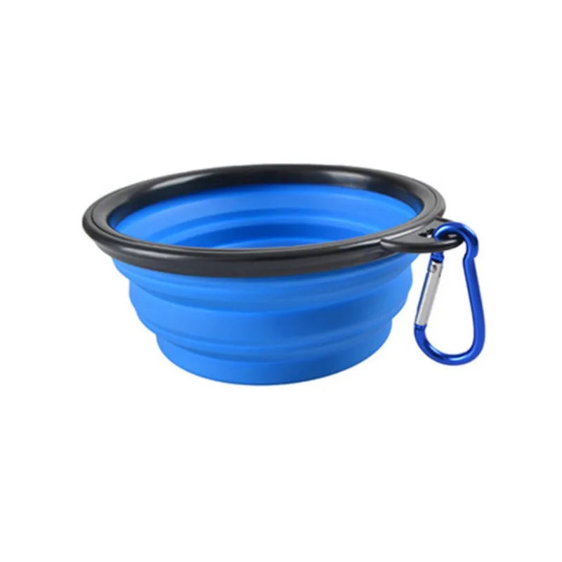A bright blue collapsible silicone pet travel bowl with a black rim and attached leash.