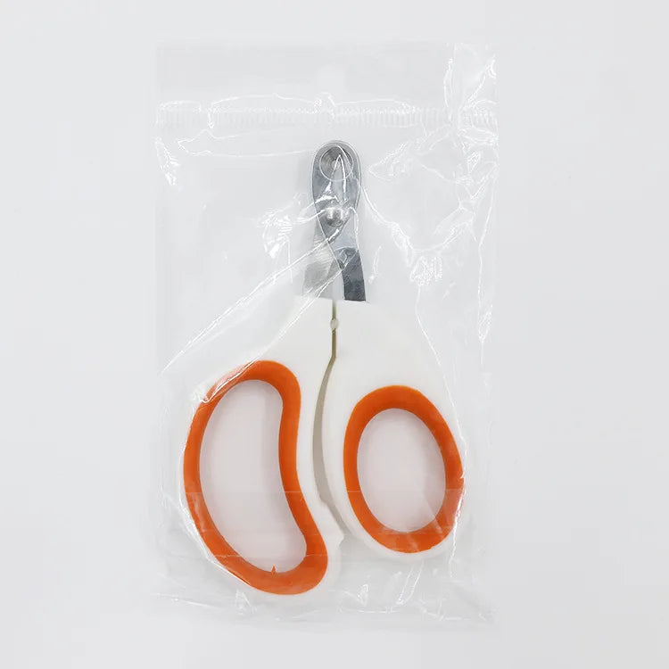 Edelstahl-Krallenatz für Katzen in einer durchsichtigen Plastiktüte mit einem orangen Nagel