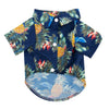 A dark blue short-sleeved shirt with a tropical pineapple and leaf print for a dog.