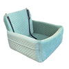 A light blue quilted dog car seat with black straps and a removable orthopedic cushion.
