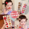 A set of five adorable flower-shaped baby hair clips in various colors and patterns for infants