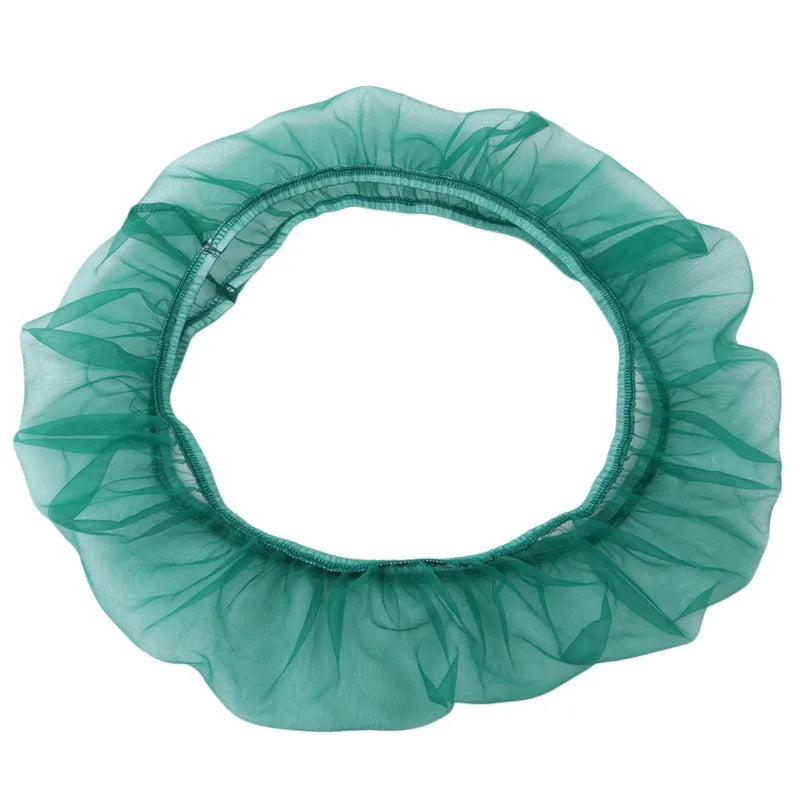 A circular, sheer teal nylon mesh skirt designed as a debris guard for a bird cage seed catcher.