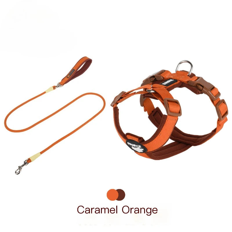 A brown dog harness with orange reflective strips shown against a white background.