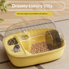 A yellow dual-space habitat cage for hamsters with a clear lid and food compartments.