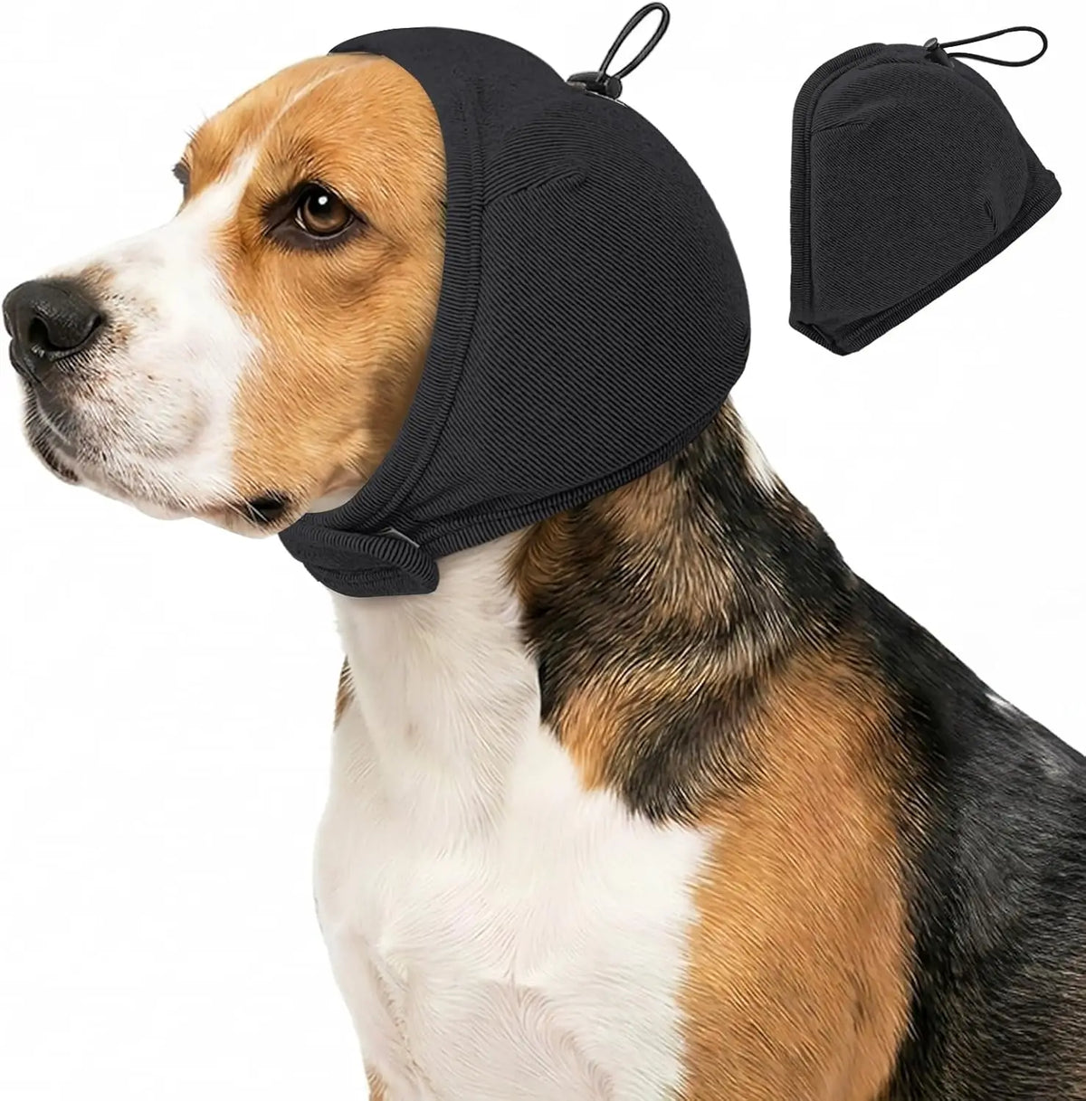 A dog wearing a black calming headgear and a separate black ear cover.