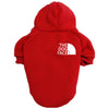 A red cozy fleece dog hoodie with a white logo on the back.