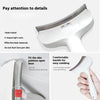 A white pet slicker brush is shown with a V-shaped comb and a comfortable handle for grooming.