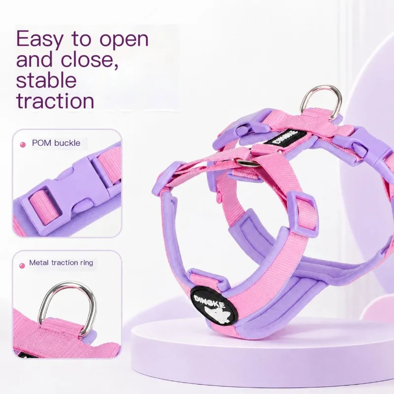 A purple and pink breathable no-pull dog harness is shown with close-ups of the POM buckle and metal traction ring.