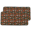 A dark green fabric liner with an orange and white mushroom pattern for a reusable absorbent cage.