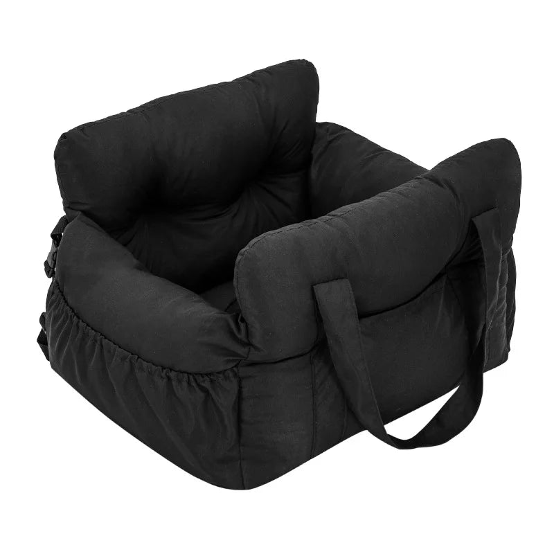 A black durable pet car seat with safety straps.
