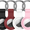 Silicone AirTag protective cover in black, red, white, and pink colors with a keychain ring.
