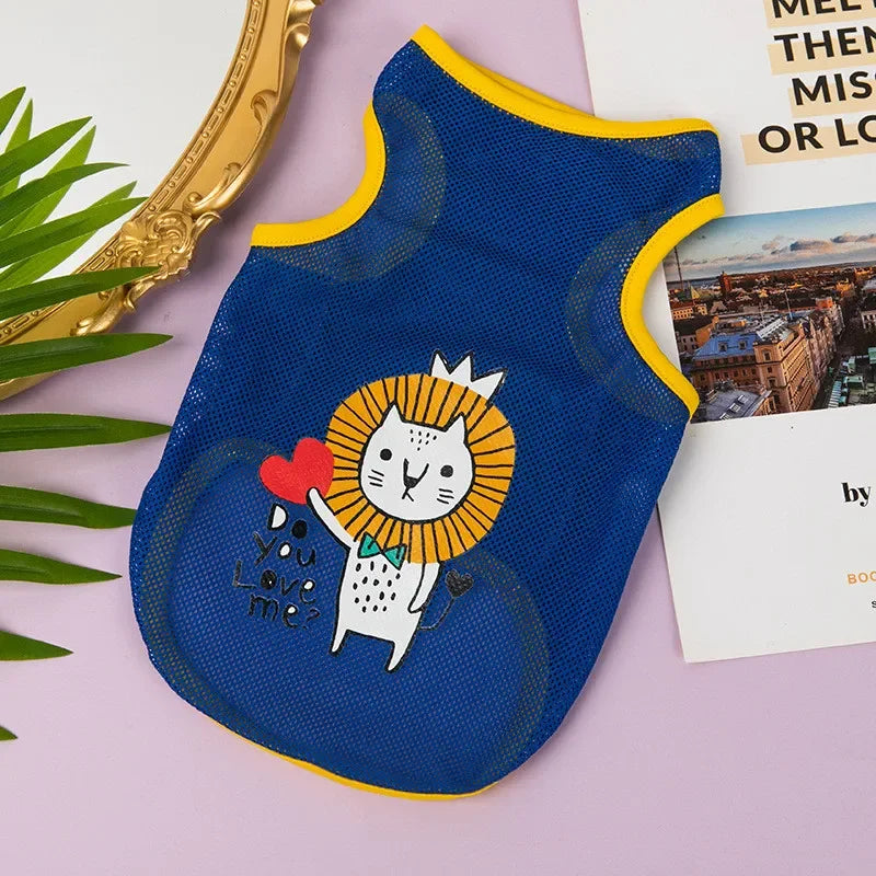 A royal blue breathable mesh pet vest with a yellow trim and a cartoon lion face print on the front.