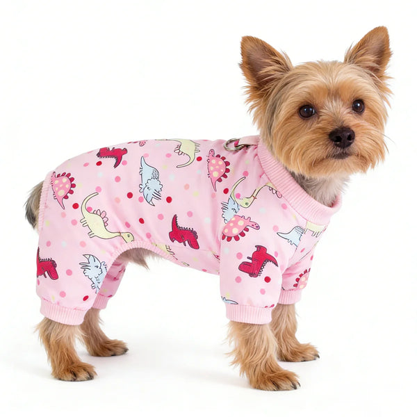 A small, light brown dog wearing a pink soft cotton pajama with colorful embroidered patterns.