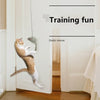 A cat is playing with an elastic mouse toy hanging from a stick inside a white door frame.