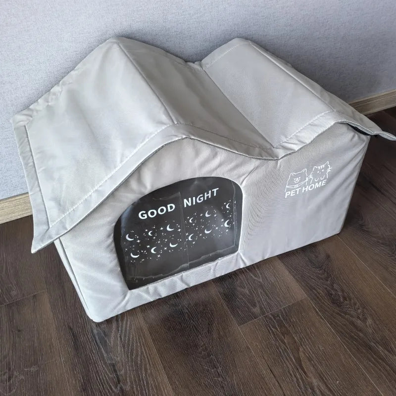 A light gray portable cat cooling house with a dark plaque engraved with good night and pet home text.