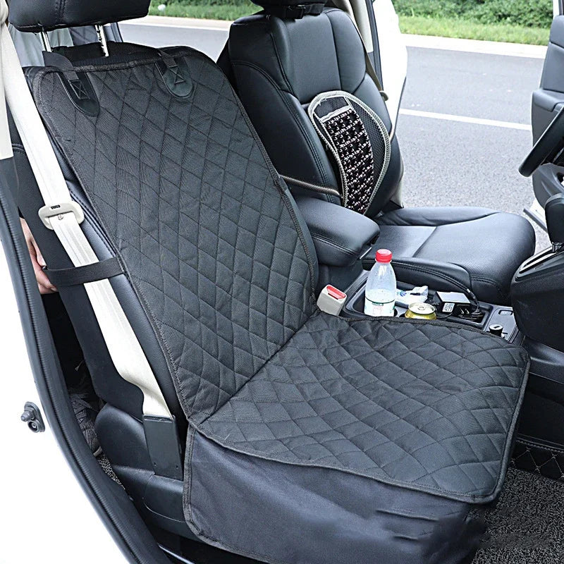 Black waterproof dog car seat cover with a mesh window and side zippers installed in a vehicle seat.